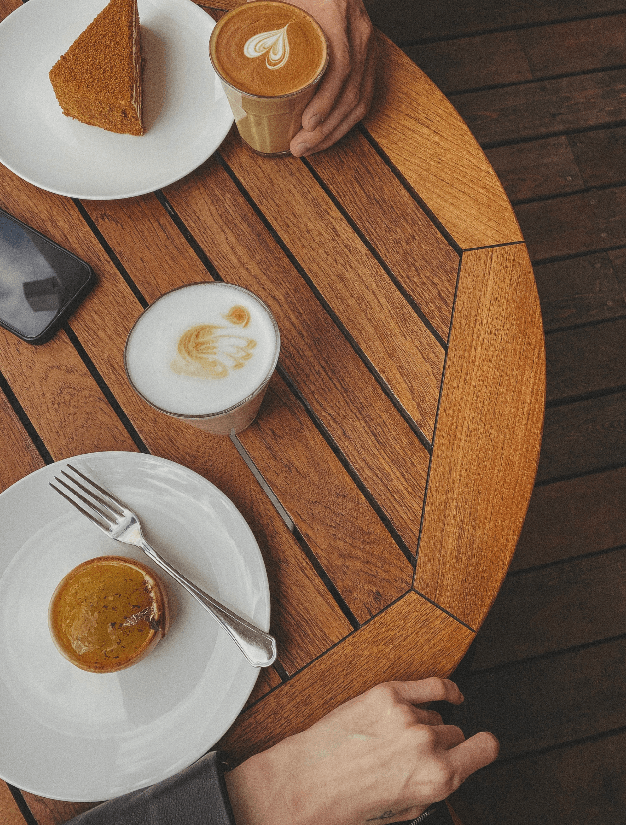 two people enjoying coffee and cake