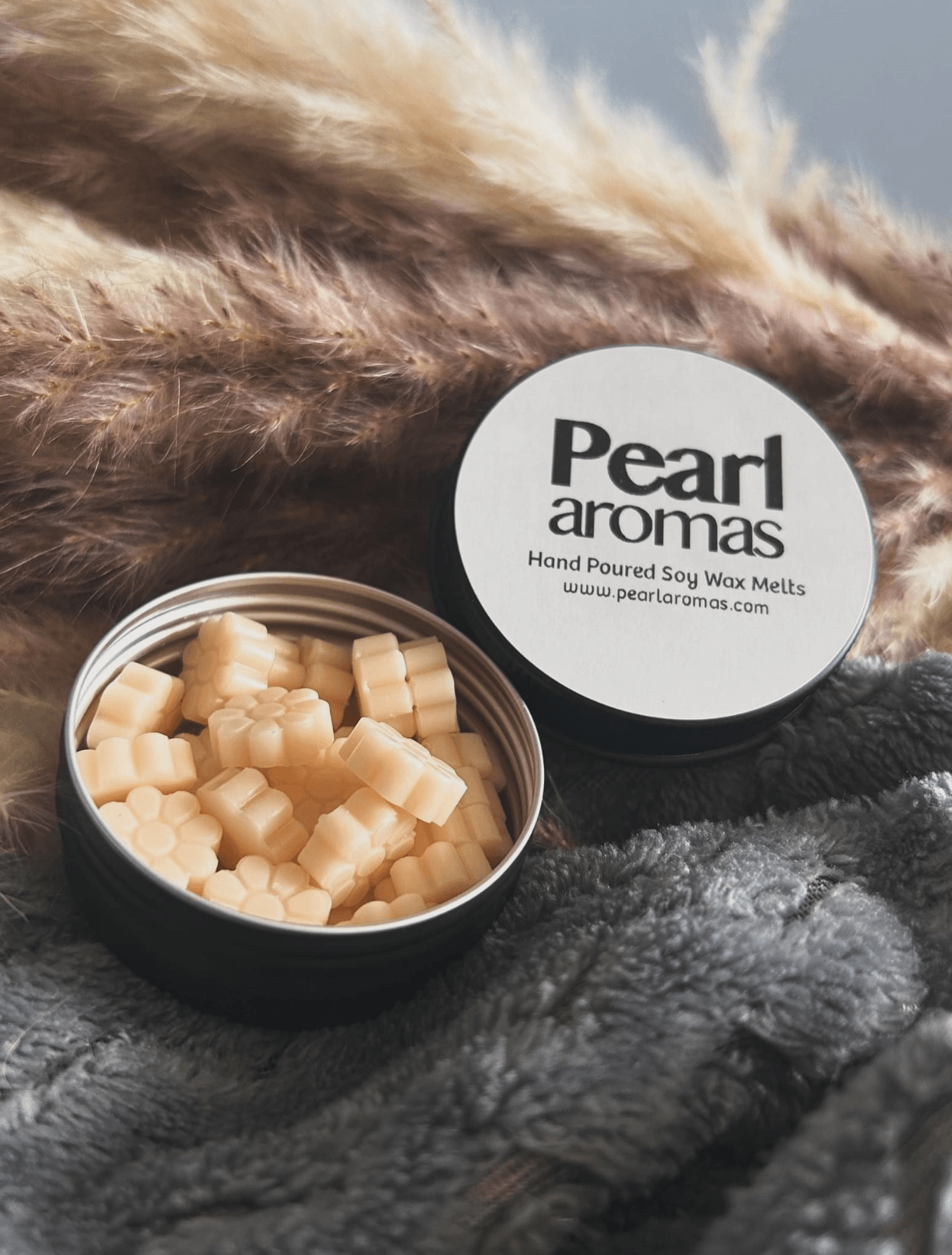 open metal tin of wax melts