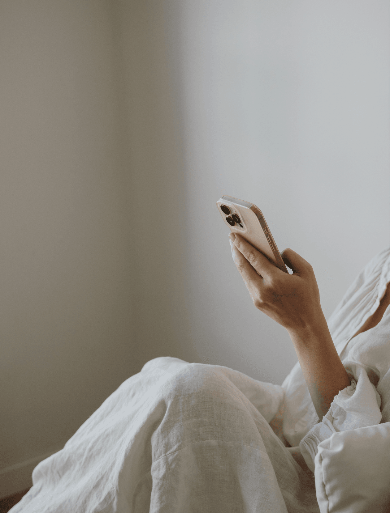 someone sitting scrolling on their phone