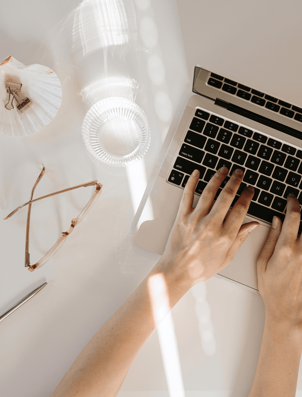 someone typing on a laptop keyboard - lifestyle shot